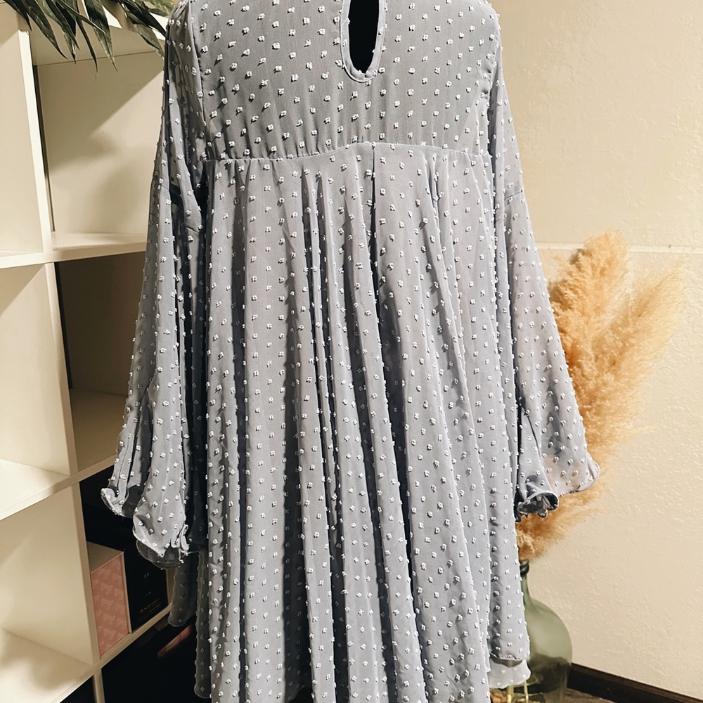 Dress with long flowy sleeves, very light. Only worn once